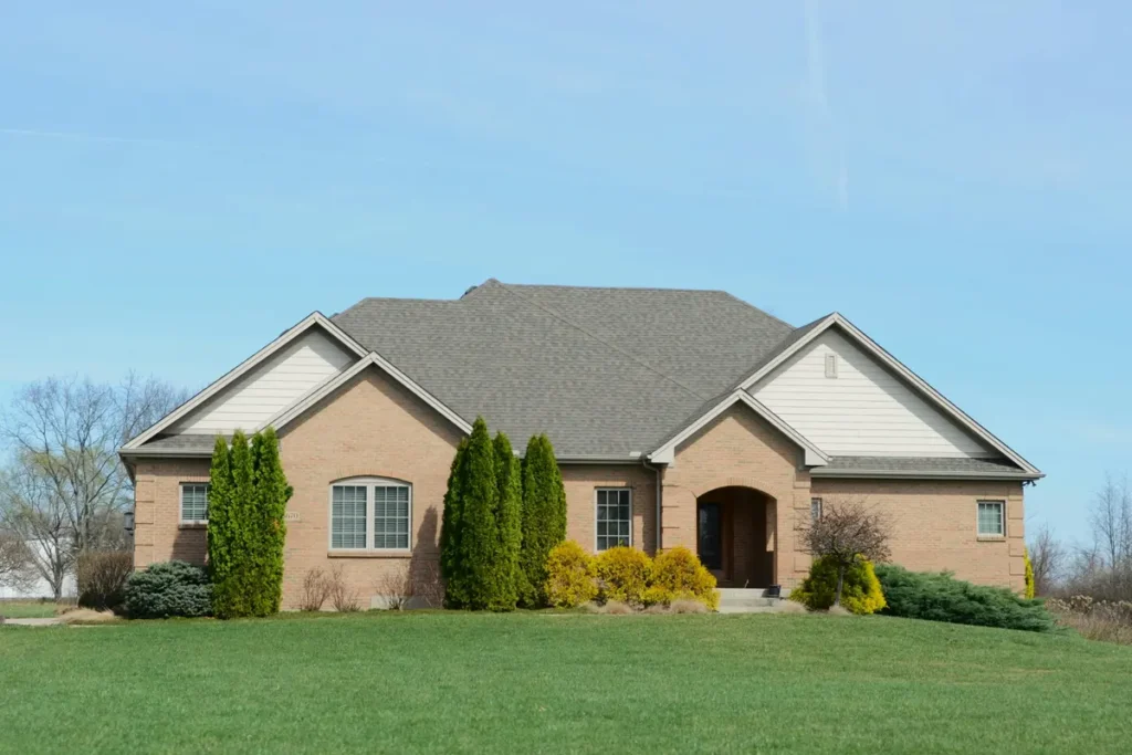 Brick house exterior with a lawn
