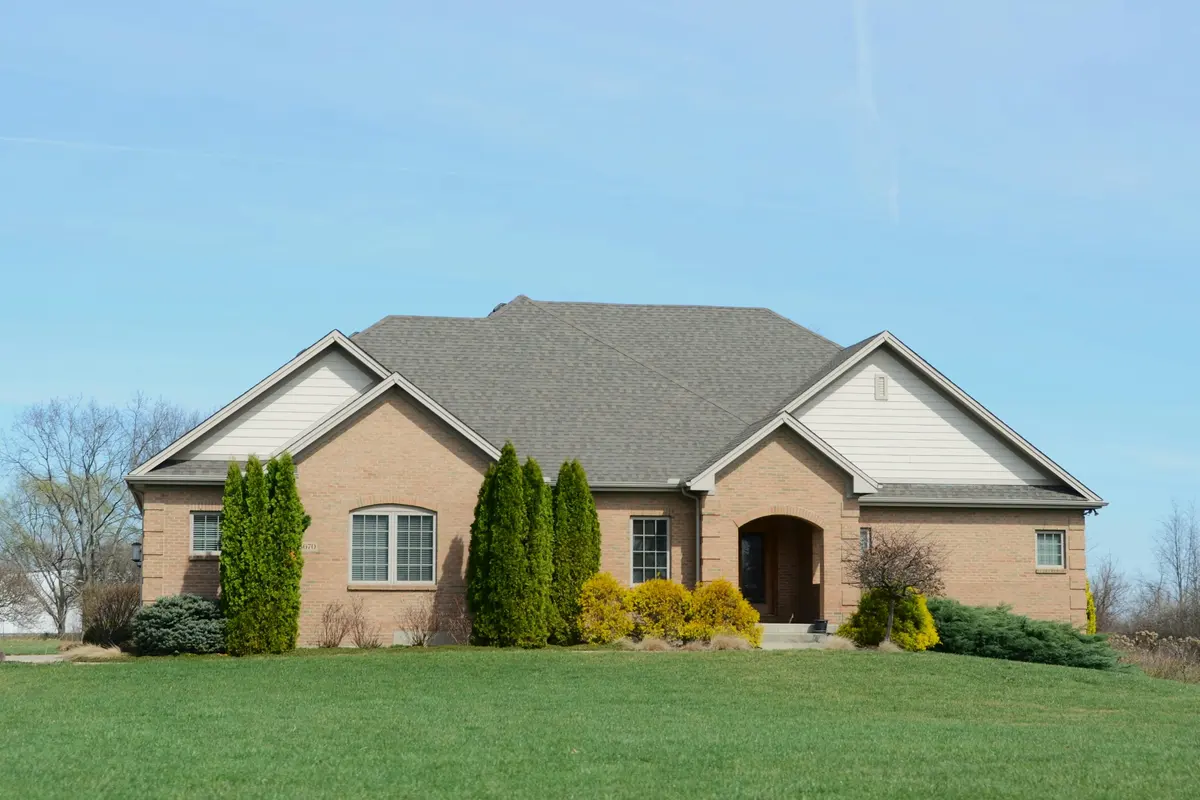 Brick house exterior with a lawn